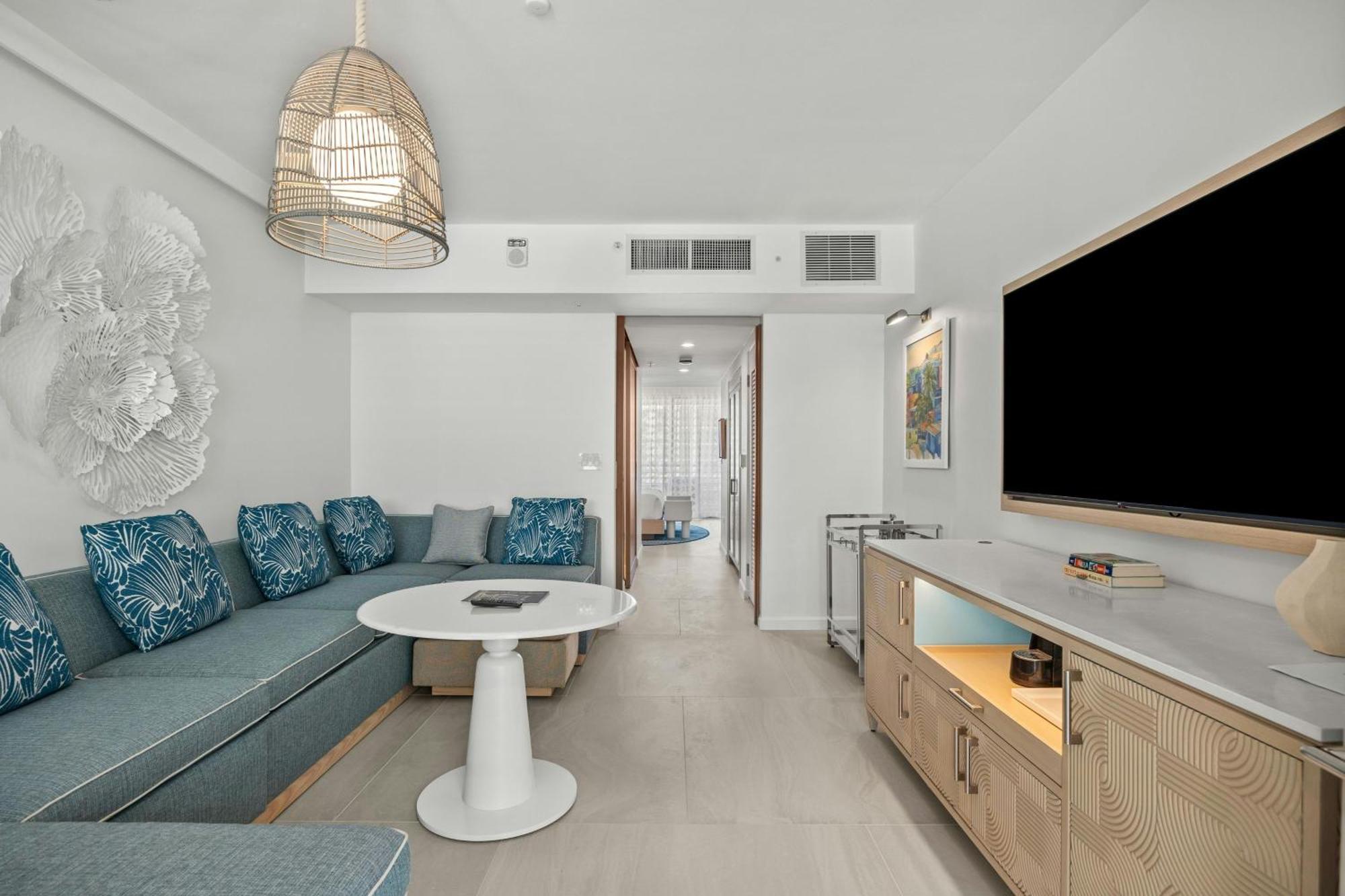 One-Bedroom Deluxe King Suite Sofa Bed Partial Ocean View