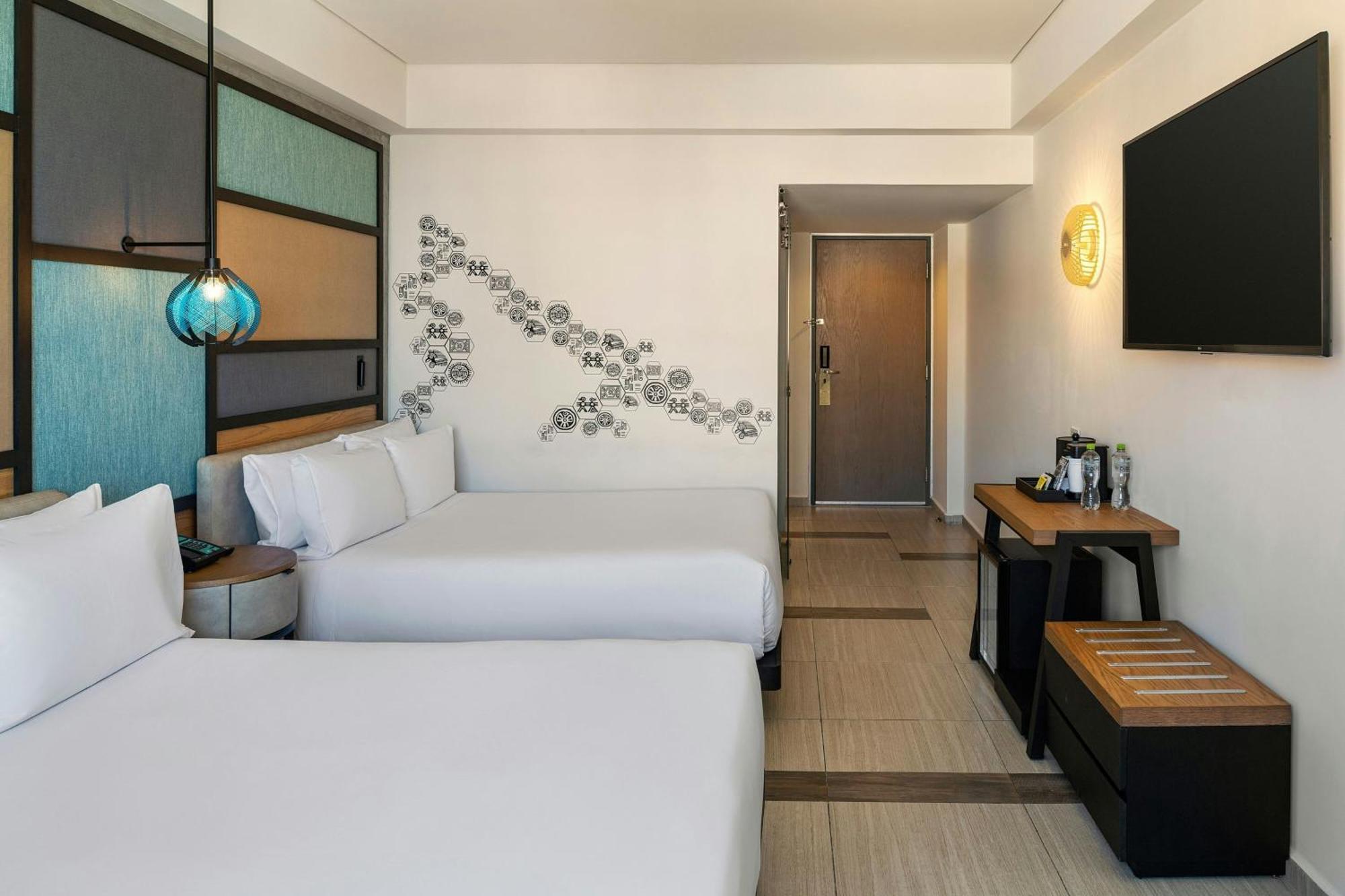 Aloft Ocean View Guest room 2 Queen Complimentary open bar